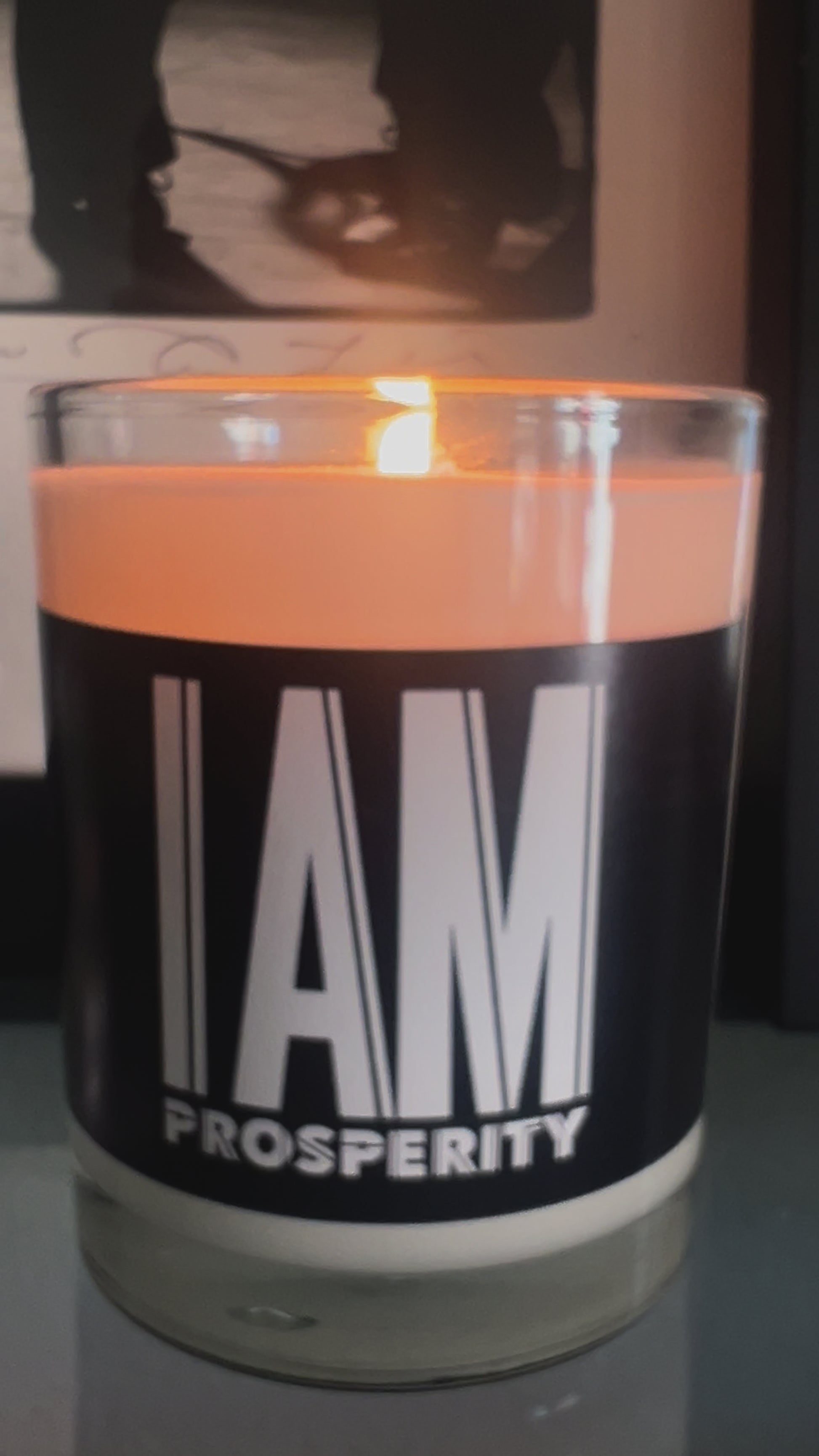 White soy wax candle in a glass vessel. Black label with the affirmation "I am Prosperity" in white aesthetic text. 